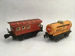 Tin Litho Train Set Of 2 Red Caboose & Shell Tanker Car Yonezawa Toys Japan. Fixed Price $20.00.