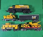 1992 Caterpillar Construction Express Toy Train Set / 5 Cars Only - No Track. Fixed Price $64.99.