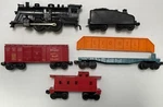 Vintage Lionel Post War 1061 Steam Engine And Freight Cars 638-2361, 6511-2. Fixed Price $120.00.