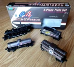 1996 Revell Collection 4-PIECE Train Set Smith & Wesson 44 Magnum Ho Scale #3117. Fixed Price $35.00.