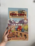 Tomy Little Choo-choo's Runaway Adventure Pop-up Book & Wind-up Train Track Set. Fixed Price $65.00.