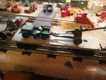 Lionel Postwar # 6401-25 Gray Flat Car With Payton Army Jeep & Howitzer Cannon.. Fixed Price $54.69.