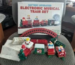 Vtg 1985 Melody Battery Operated Electronic Musical Train Set/ Complete. Fixed Price $34.95.