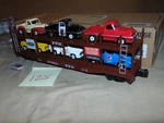 Menards Gauge 275-3914 Ttx Autocarrier With 6 Ford Pick Ups + Box #125. Fixed Price $65.00.