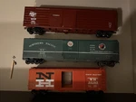 3 Scale Boxcars New Haven Milwaukee Road Northern Pacific. Fixed Price $150.00.